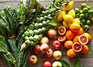 a group of fruits and vegetables on a wood surface Healthy Weight Loss Diets Perth