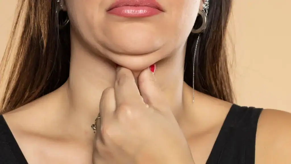 An image of a woman with double chin, sad, worried : Non Surgical Double Chin Removal Treatment in Perth, UK